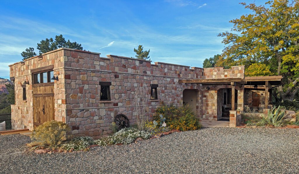 Vacation-home-flowerbeds-enhance-stone-facade